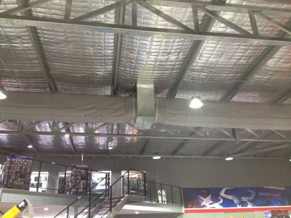 Commercial evaporative air conditioning with duct sock